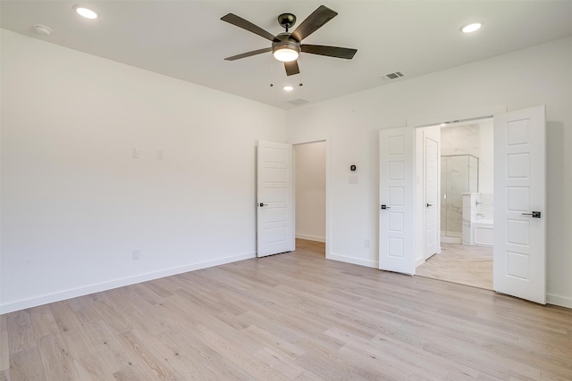 unfurnished bedroom with ceiling fan, light hardwood / wood-style floors, and ensuite bath