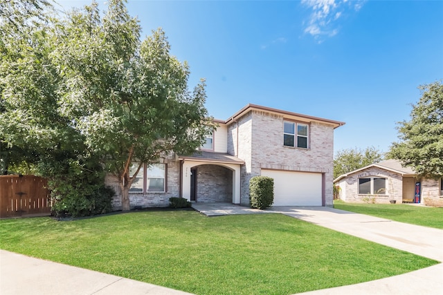 view of front of home featuring a front lawn and a garage