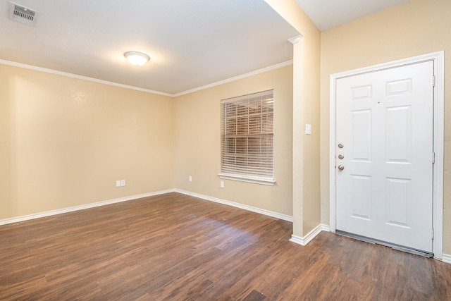 foyer with crown molding and dark hardwood / wood-style floors