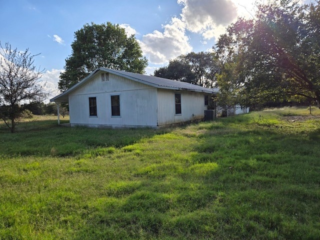 view of home's exterior with a lawn