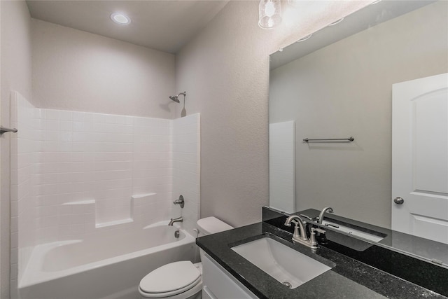 full bathroom featuring vanity, washtub / shower combination, and toilet