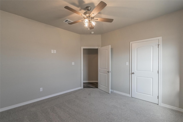 unfurnished bedroom with carpet flooring and ceiling fan