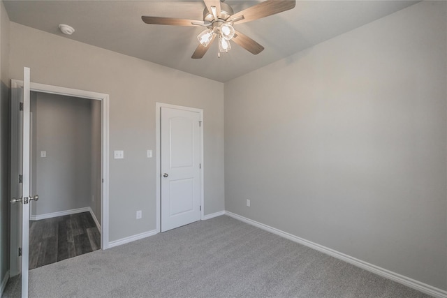 unfurnished bedroom featuring a closet, ceiling fan, and carpet flooring