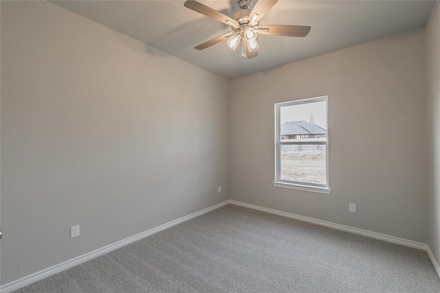 unfurnished room featuring ceiling fan and carpet floors