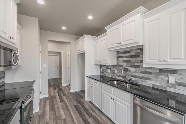 kitchen featuring sink, white cabinets, stainless steel appliances, and dark hardwood / wood-style floors