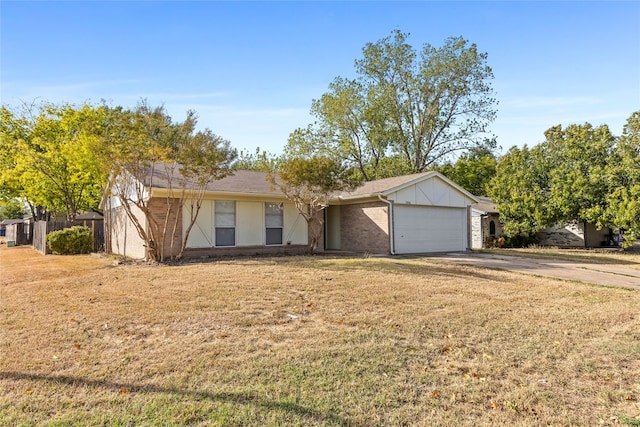 single story home with a front yard and a garage