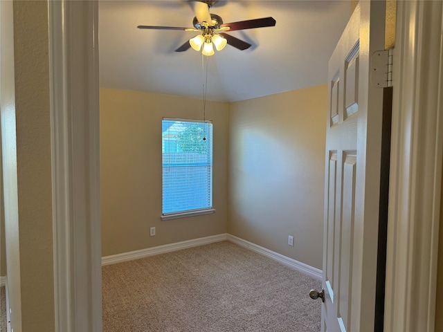 carpeted empty room with ceiling fan