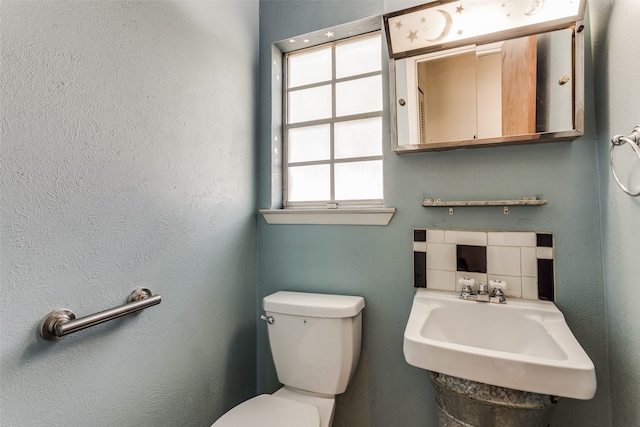 bathroom with toilet and sink