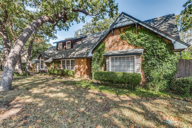 tudor house with a front lawn