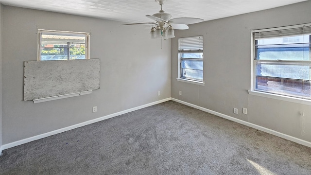 empty room featuring carpet flooring and ceiling fan