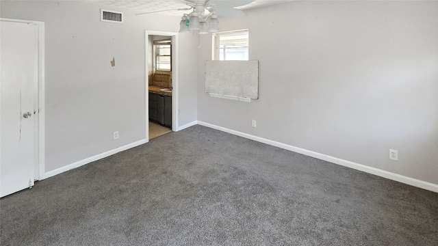 5706 Rocky Ridge Rd, Dallas, TX 75241 - empty room with a ceiling fan, carpet flooring, and baseboards