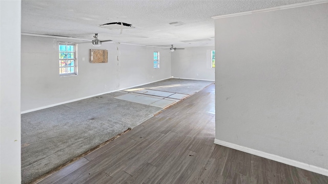 empty room with crown molding, a textured ceiling, hardwood / wood-style flooring, and ceiling fan