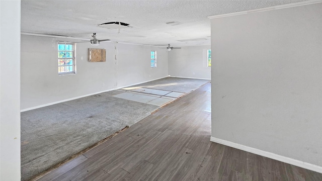 5706 Rocky Ridge Rd, Dallas, TX 75241 - empty room featuring a ceiling fan, baseboards, healthy amount of natural light, a textured ceiling, and wood finished floors