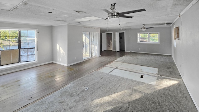 5706 Rocky Ridge Rd, Dallas, TX 75241 - spare room featuring wood finished floors, a ceiling fan, baseboards, a textured ceiling, and crown molding