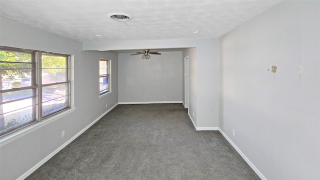 carpeted empty room featuring ceiling fan