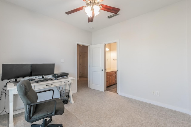 office area with ceiling fan and light colored carpet