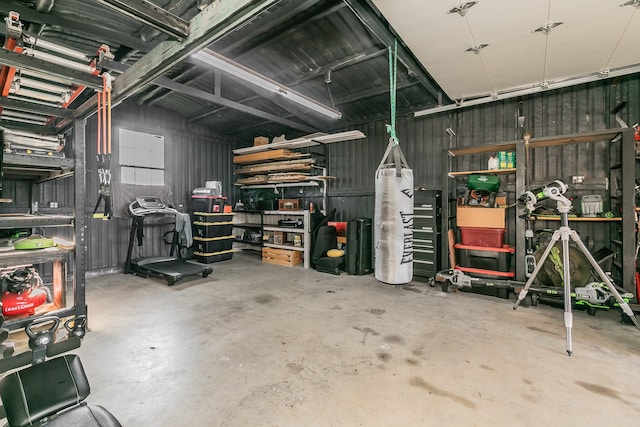 garage featuring wooden walls