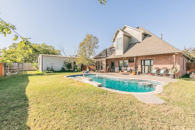 view of swimming pool with a lawn and a patio