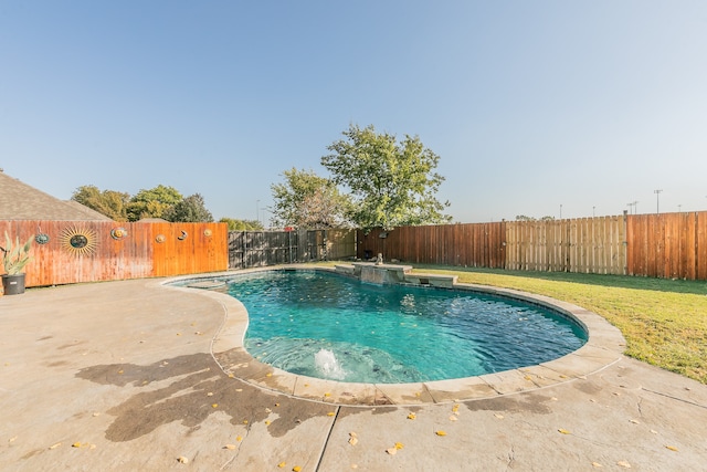 view of pool featuring pool water feature and a patio