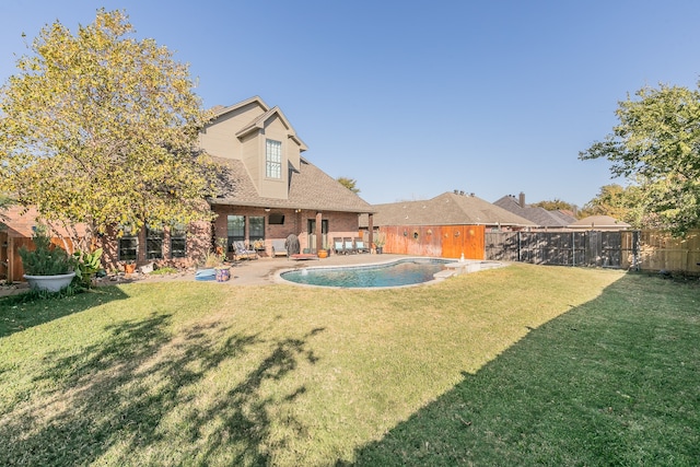 view of yard with a patio area and a fenced in pool