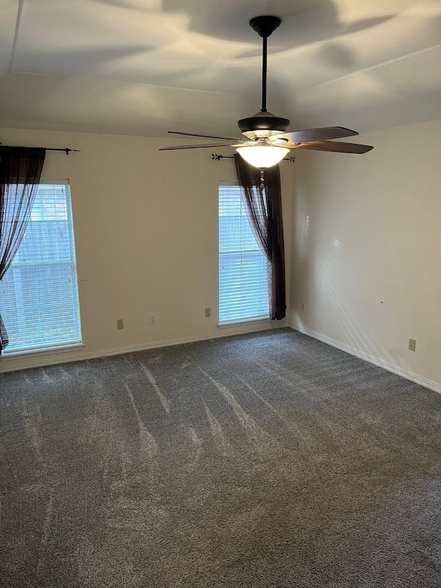 empty room with carpet floors and ceiling fan