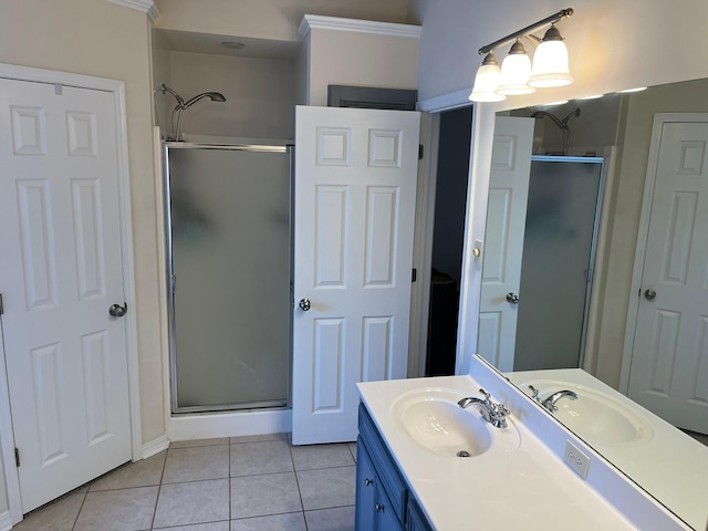 bathroom featuring tile patterned flooring, vanity, and a shower with shower door