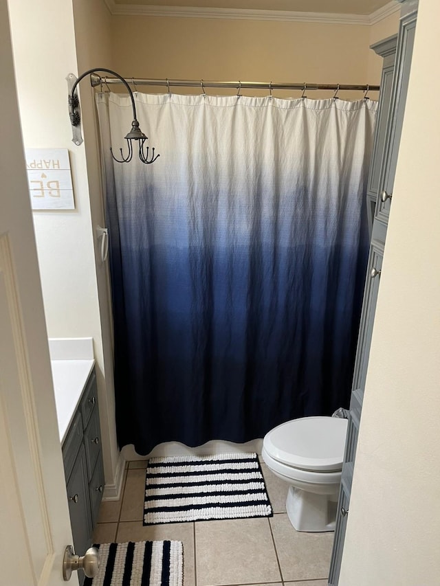 bathroom featuring ornamental molding, vanity, toilet, and tile patterned flooring