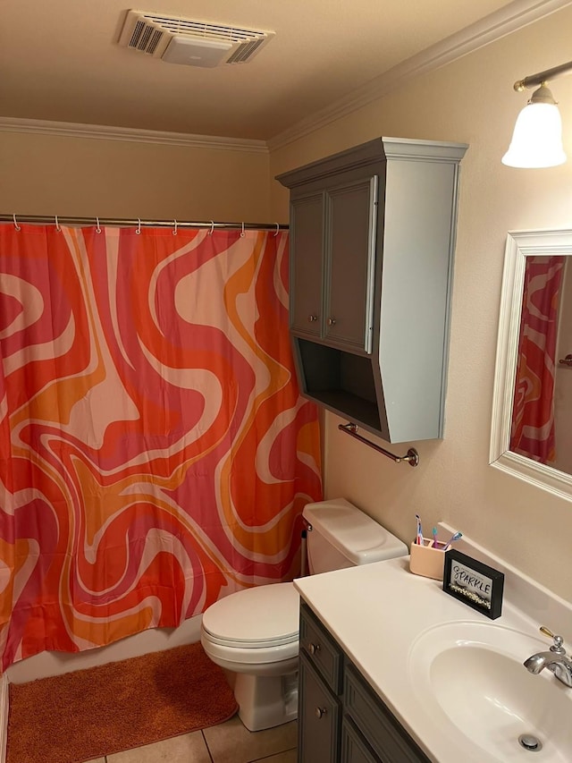 bathroom with ornamental molding, toilet, tile patterned flooring, and vanity