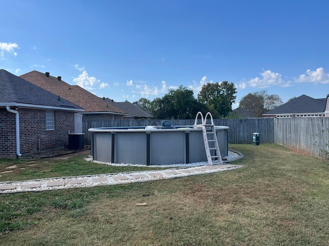 exterior space featuring a yard and central air condition unit