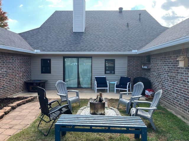 view of patio with a fire pit