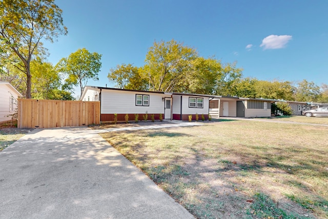 ranch-style house with a front yard