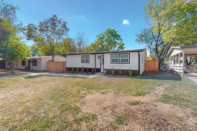 ranch-style house with a front lawn