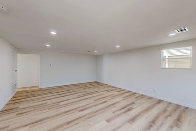 spare room featuring light wood-type flooring