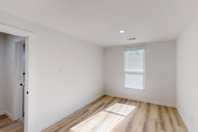 spare room with light wood-type flooring