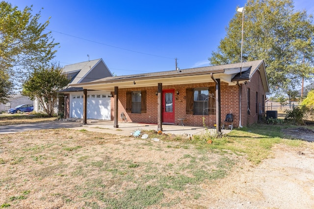 single story home with a front lawn and a garage