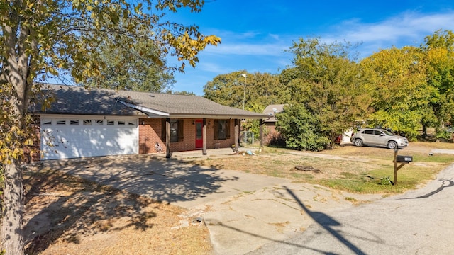 ranch-style home featuring a garage