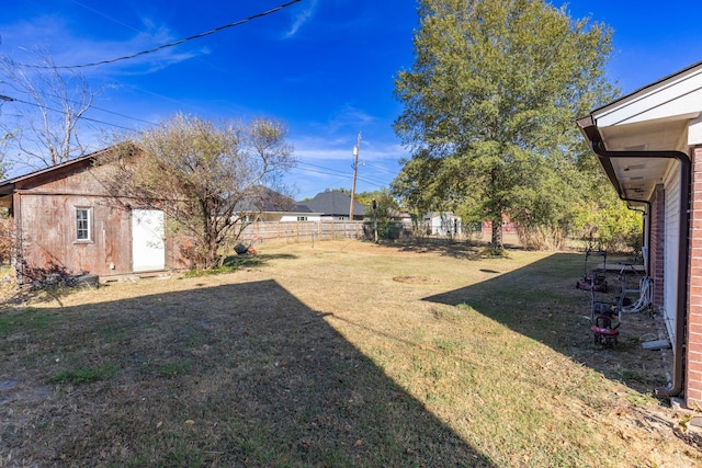 view of yard featuring a storage unit