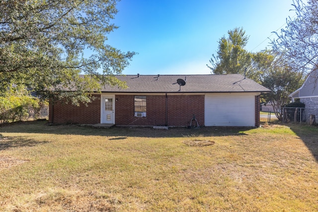 rear view of house with a yard