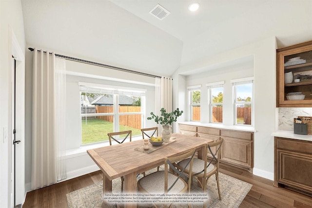 dining space featuring dark wood-type flooring