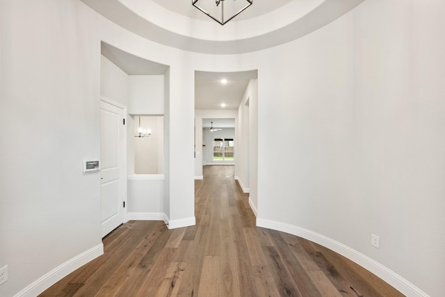 corridor with wood-type flooring