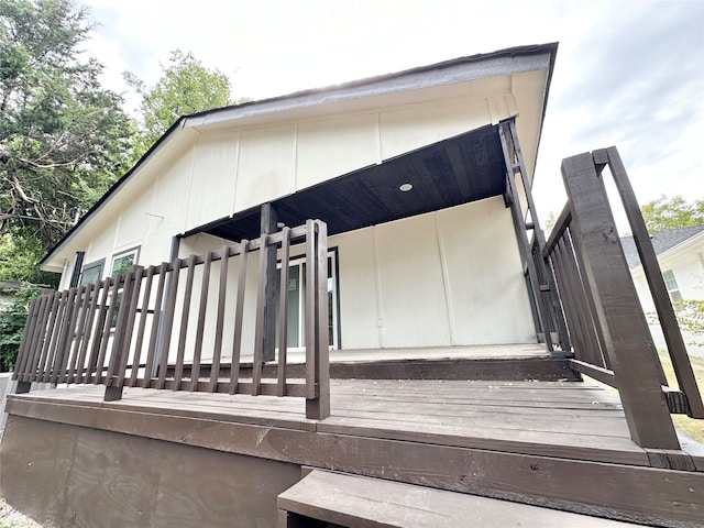 view of home's exterior with a wooden deck