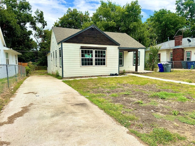 bungalow-style house featuring a front yard