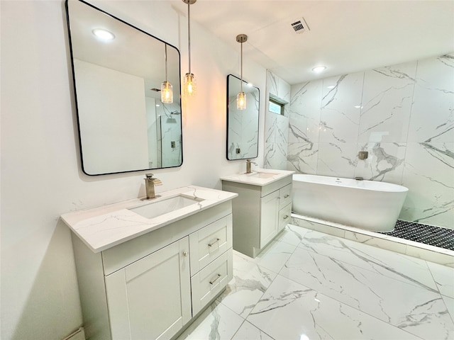 bathroom with vanity and a washtub