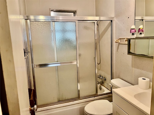 full bathroom with vanity, toilet, decorative backsplash, and enclosed tub / shower combo