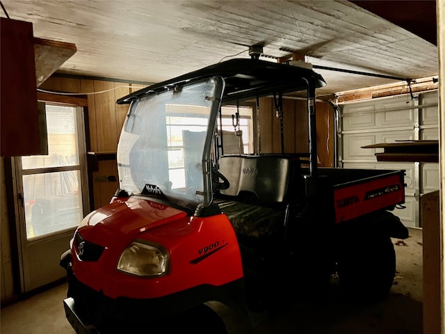 garage featuring wooden walls