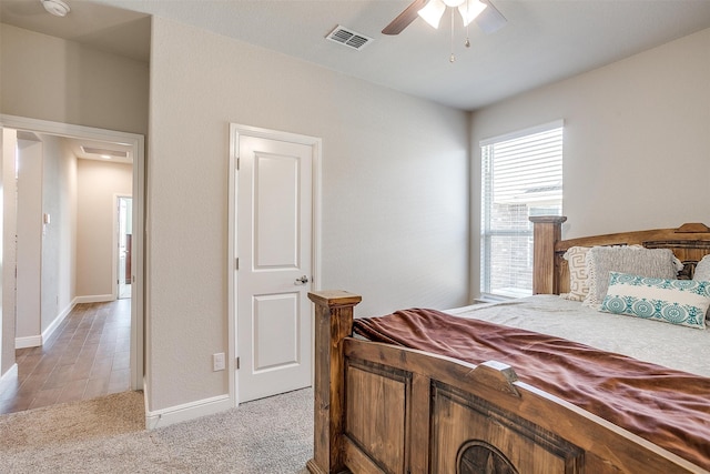 carpeted bedroom featuring ceiling fan