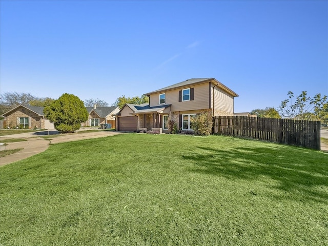 rear view of property with a lawn and a garage