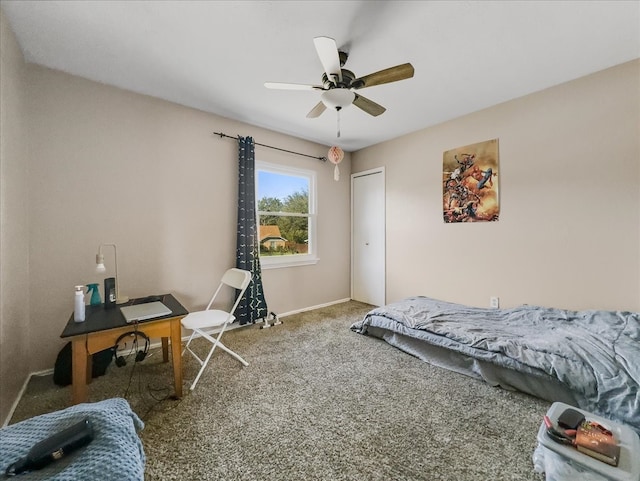 bedroom with ceiling fan, carpet floors, and a closet