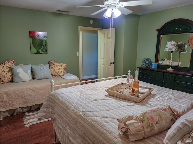 bedroom featuring hardwood / wood-style flooring and ceiling fan