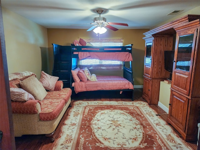 bedroom featuring ceiling fan and wood-type flooring